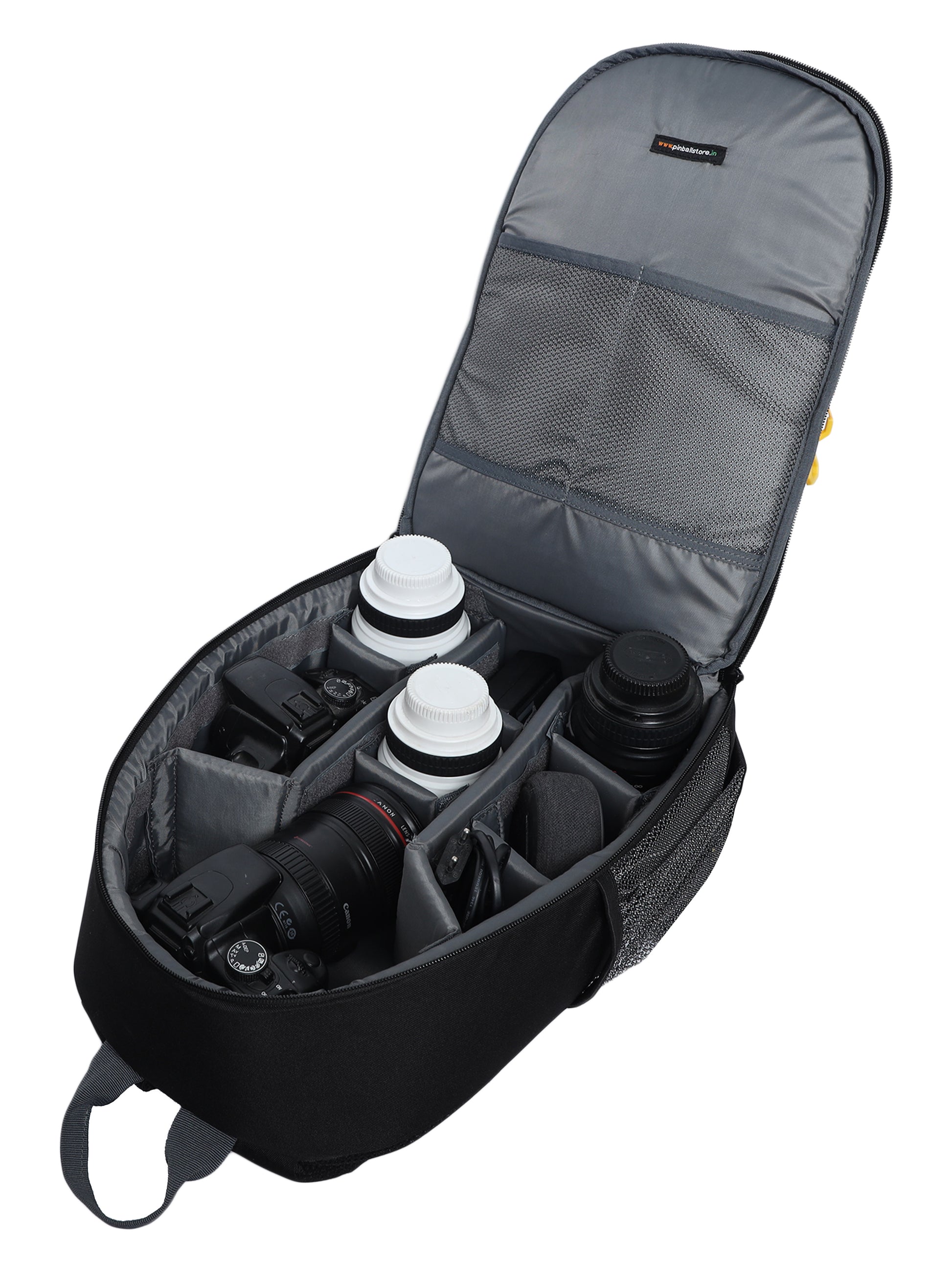 Open view of the 'Game On' camera bag from the Game series, showcasing its well-organized compartments filled with camera equipment and accessories. The bag provides secure storage for a camera body, lenses, memory cards, and other essential items. With its spacious interior and smart organization, the 'Game On' camera bag ensures easy access and protection for your photography gear while on the go